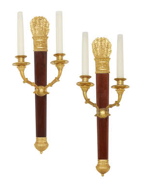 
	
		A pair of French Empire style wall lights, 20th century, the backplates formed as...