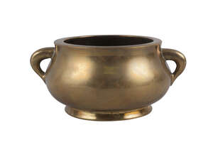 
	
		A Chinese polished bronze bombe censer, Xuande mark, 19th century, of typical form with...