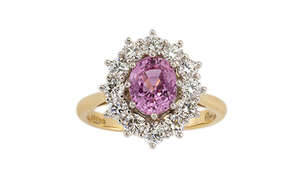 
	
		A pink sapphire and diamond cluster ring by Asprey & Garrard, the oval pink sapphire...