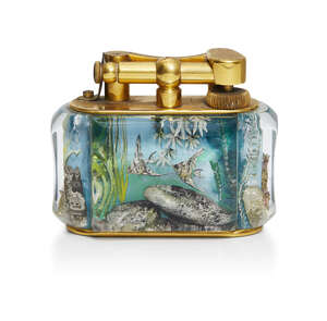 
	
		Dunhill, an 'Aquarium' gold-plated brass and Lucite table lighter
		1950s, Stamped...
