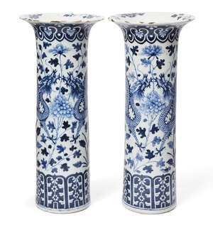 
	
		A pair of large Chinese porcelain sleeve vases, early 19th century, painted in underglaze...