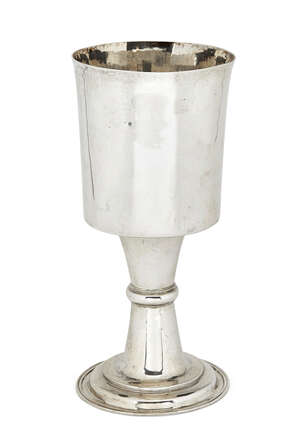 
	
		A large white metal goblet, unmarked, the plain cylindrical cup to waisted stem raised on...