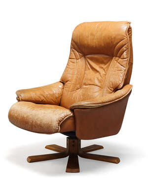 
	
		Skoghaug Industri, a brown leather reclining lounge chair    
		c.1970, applied...