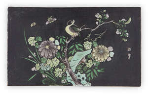 
	
		A Chinese black ground famille verte biscuit tile, 19th century, enamelled with a magpie...