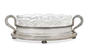 
	
		A Russian cut glass dish raised on a silver stand, by Faberge, the navette-shaped cut...