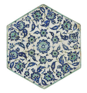 
	
		An Iznik style tile, Turkey, early 20th century, of hexagonal form, underglaze painted in...