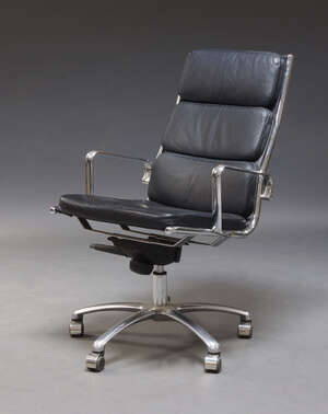 
	
		After Charles and Ray Eames, an EA219 style office chair, upholstered in black leather,...
