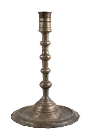 
	
		A brass candlestick, Russia, dated 27 January 1914AD, the base faceted and with a flower...
