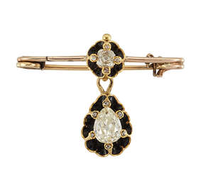 A 19th century diamond and black enamel pendant brooch, composed of a single old-brilliant-cut pear-shaped diamond drop weighing approximately 1.00 carats,  wi
