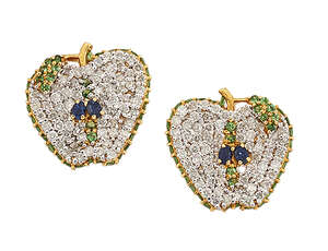 
	
		A pair of diamond, garnet and sapphire ear studs, each designed as a cut apple, pave-set...