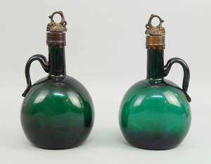 
	
		Two Georgian green glass and metal mounted decanters, late 18th century, each with grape...