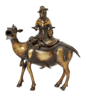 A Chinese gilt-bronze 'mythical beast and rider' censer and cover, 17th-18th century, cast as a horned beast standing with mouth open, the cover is sur