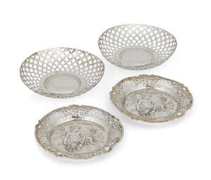 Two small silver dishes, London, c.1896, James Dudley, each with repousse scene to base depicting a centaur and fruiting vines, 12.3cm dia., together with two 