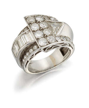 
	
		An Art Deco platinum and diamond cocktail ring, of buckle design, set with a...