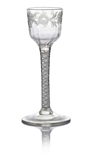A George III wine glass, c. 1775, with ogee bowl engraved with a floral border and flute moulded lower half above a double series opaque twist, on circular foo