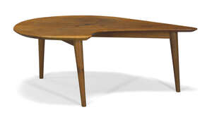 
	
		A teak boomerang coffee table  
		c. 1950  
		The shaped top on splayed and tapering...