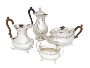 A three-piece tea and coffee service, Birmingham, c.1922, Alexander Clark & Co., comprising a tea pot, coffee pot and sugar dish, each decorated with a shallow