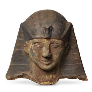 
	
		A Continental fragmentary terracotta head of a pharaoh, in the Egyptian taste, 20th...