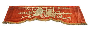 
	
		A red velvet embroidered pelmet, British, mid 19th century, with embroidered strap-work...