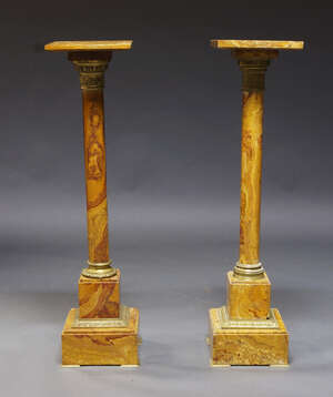 
	
		Two similar gilt metal and yellow marble pedestals, late 19th/early 20th century, each...