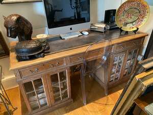 
	
		A Victorian limed oak glazed twin pedestal writing desk, c.1880, of unusual design the...