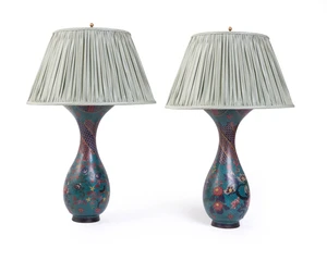 A pair of Japanese cloisonne enamel twin-light vase lamps, early 20th century, each decorated with chrysanthemum and other flowers, the neck with a repeating g