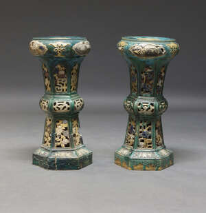 
	
		A pair of Chinese Pottery jardiniere stands, late 19th/early 20th century, decorated with...