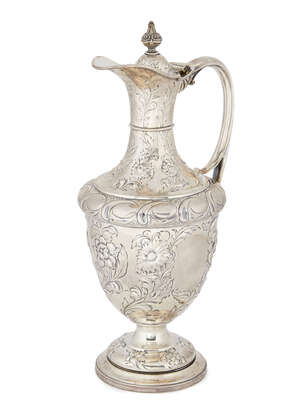 
	
		An Edwardian silver wine ewer, Sheffield c.1902, Atkin Brothers, with repousse scrolling...