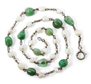 
	
		A South Indian emerald and pearl necklace, 19th century, with silver chain links between...