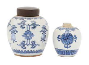 Two Chinese porcelain jars, 18th century, painted in underglaze blue with stylised floral sprays, 17cm x 14cm high, one with later wood cover (2)
		Provenance