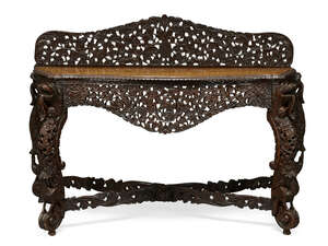 
	
		A Colonial Burmese teak side table, late 19th century, profusely carved to the back and...