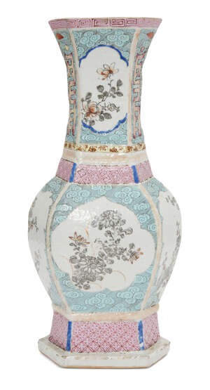 A Chinese porcelain hexagonal vase, Qianlong period, painted in famille rose enamels with panels of floral sprays on a turquoise ground decorated with clouds, 