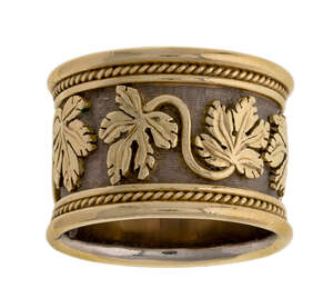 
	
		An 18ct gold, vine leaf ring, by Elizabeth Gage, decorated with twin vine leaf motifs,...