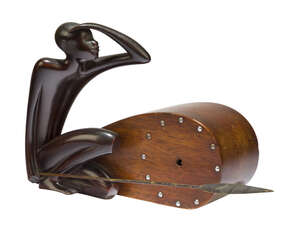 
	
		Hagenauer Werkatatte, a carved wood and ebonised figural clock
		c.1930, impressed...