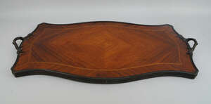 
	
		A French shaped rosewood and line inlaid tray, late 19th/early 20th century, with a metal...