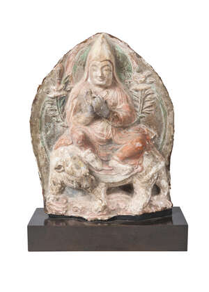 
	
		A rare Tibetan painted terracotta votive figure, 17th century, depicting lama on an...