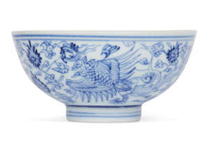 A Chinese porcelain 'Phoenix' tea bowl, Yongzheng mark and of the period, painted in underglaze blue to the exterior with two phoenixes amid meandering