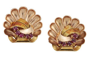 
	
		A pair of Retro gold and ruby earclips, of fan design with circular cabochon ruby curved...