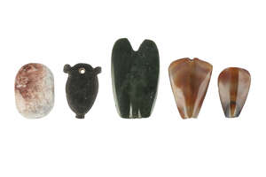 
	
		A group of five hardstone Amuletic beads, of various forms, largest 5cm. high...