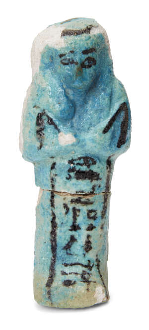 An Egyptian turquoise glazed composition shabti with black glazed details, holding two hoes, with a frontal column of hieroglyphic text, inscribed for Djed-Pta