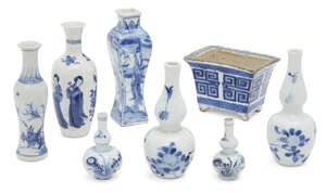 Seven Chinese porcelain small vases and a jardinière, 17th-18th century, to include one square waisted vase painted in underglaze blue with ladies, 6.5cm - 13