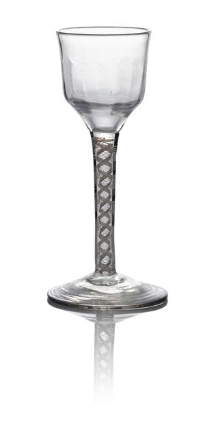 A George III wine glass, c. 1770, with flute moulded ogee bowl above a double series opaque twist, on circular foot, 14cm high
		 