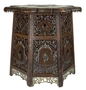 
	
		A brass and copper inlaid carved wood table top and stand, Punjab, probably Lahore,...