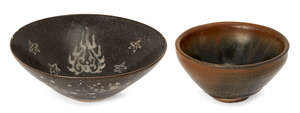A Chinese grey stoneware 'hare's fur' tea bowl, 11.5cm diameter, and a black glazed conical bowl decorated to the interior with celestial motifs, 1