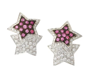 A pair of 18ct white gold pink sapphire and diamond earrings, designed as two star shaped panels...