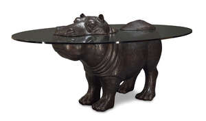 
	
		Mark Stoddart (British B.1964), a bronze and glass Hippo dining table
		c.2000, signed -...