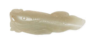 
	
		A Chinese celadon jade fish pendant, early 20th century, carved as a fish with incised...