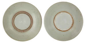 
	
		Two Chinese porcelain shallow dishes, Ming dynasty, 17th century, covered in a pale grey...