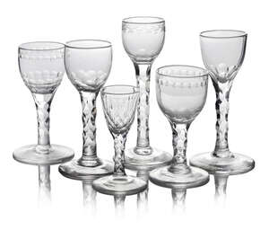 A George III drinking glass, the bowl engraved with bands of pendant buds above diaper swags, on cut facetted stem with circular foot, 16cm high, together with