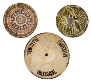 
	
		Three Nishapur pottery bowls, Iran, 9th-10th century, each of conical form, underglaze...